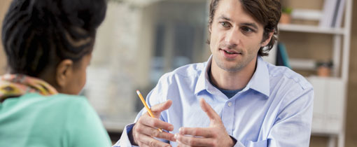 An applicant speaking to a careers advisor