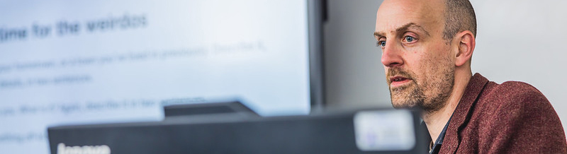 Staff member teaching at AV desk