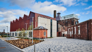 Exterior of Springfield campus with signage displaying Springfield and the University of Wolverhampton logos on the walls
