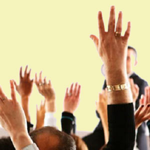 image of some peoples hands up in the air